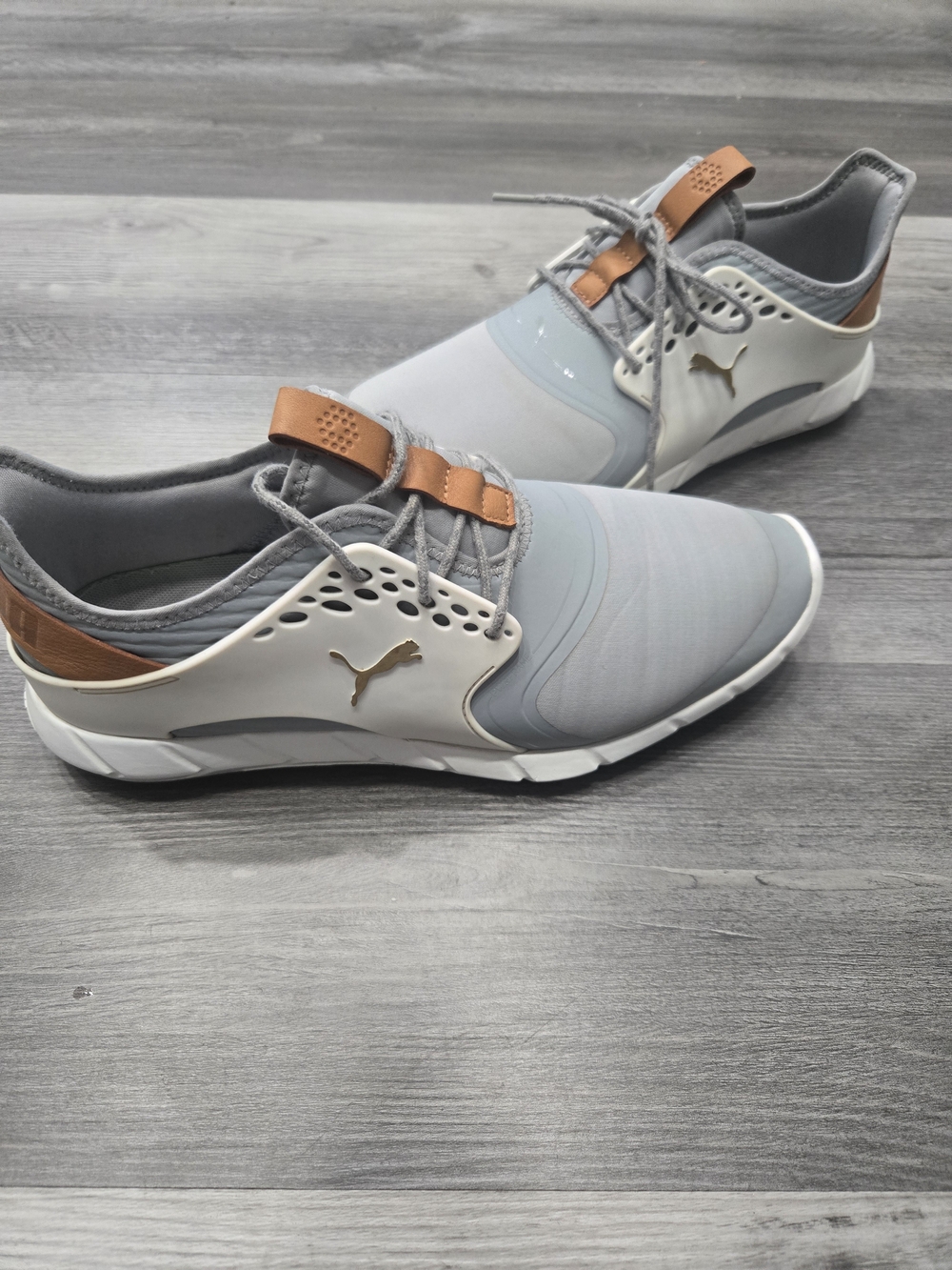 PUMA Ignite Pwrsport spikeless golf shoes in a gray and white colorway